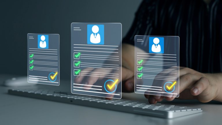 Digital documents with check marks verified staff records and online HR management. Employee approval process management